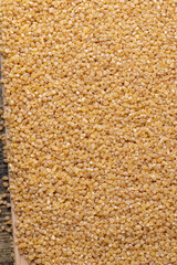 Fresh wheat porridge but cooked scattered on the table