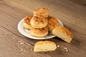 National Hungarian cuisine. Buns with cumin and fat on a white plate