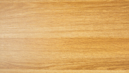 Background of a laminated panel imitating an old wooden board in dark yellow color