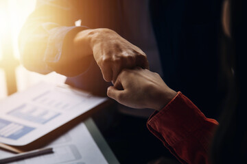 Close up ux developer and ui designer brainstorming about mobile app interface wireframe design on table with customer breif and color code at modern office.Creative digital development agency