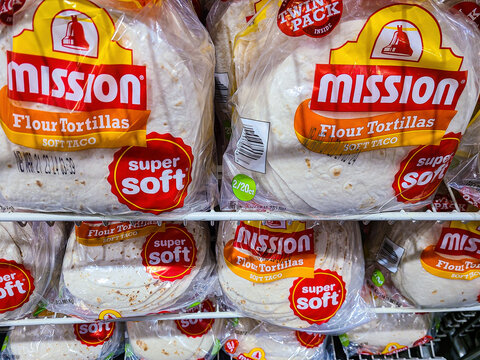 Mission Tortillas for sale and on display on a white shelf