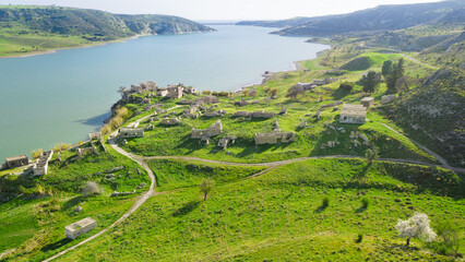 Fototapeta premium Abandoned village Foinikas at Asprokremmos dam in Paphos district, Cyprus. Aerial landscape