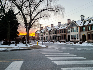 Sunset in the winter in downtown Birmingham, Michigan with townhomes in the foreground