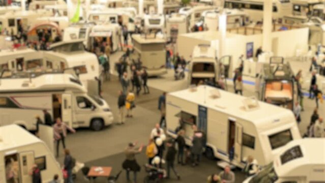 Blurred mobile home fair with various mobile home providers on the exhibition center in Hamburg 