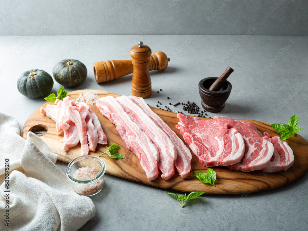 Sticker various cuts of pork meat and spices on a cutting board