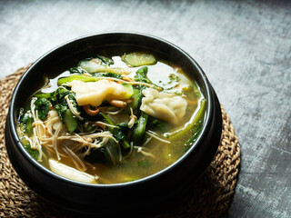 Soybean paste stew made with various vegetables and flour dough	