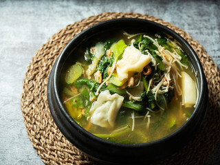 Soybean paste stew made with various vegetables and flour dough	