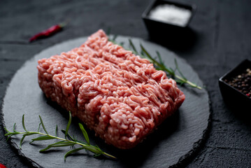raw minced pork on stone background