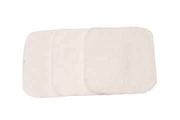 Stack of white cotton sponges isolated on a white background.