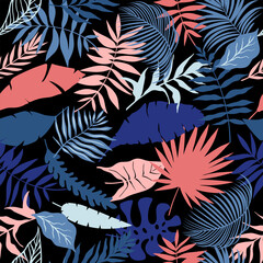Naklejka premium Bright tropical leaves vector. Seamless palm leaves on black background.