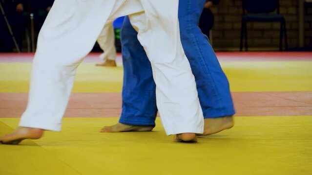 judo competition, legs judoists moving on tatami during fight, real video, summer sports games