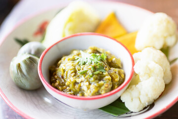 Nam Prik Noom Recipe (Northern Thai Green Chili Dip); is a common meal in northern Thailand. Always served with streamed vegetable, sticky rice and crispy pork skin.