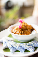 'Hung Lay' curry with pork served with steamed glutinous rice. This curry from northern Thailand is like no other. Slow-simmered, slightly sweet and tangy, and full of rich, complex flavors.