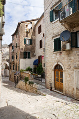 Colorful street in the old town of Kotor on a sunny day, Montenegro. Travel, vacation, walk.