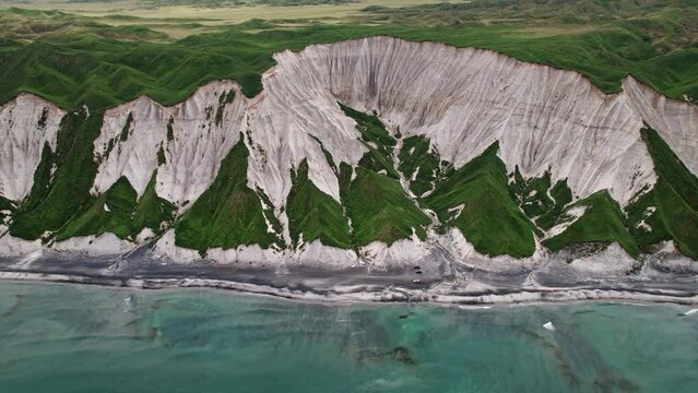 Iturup Island in the Kuril Range, surveying the coastline of the island