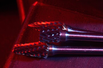 cutters of tungsten carbide on the background of metal blanks. Close-up.