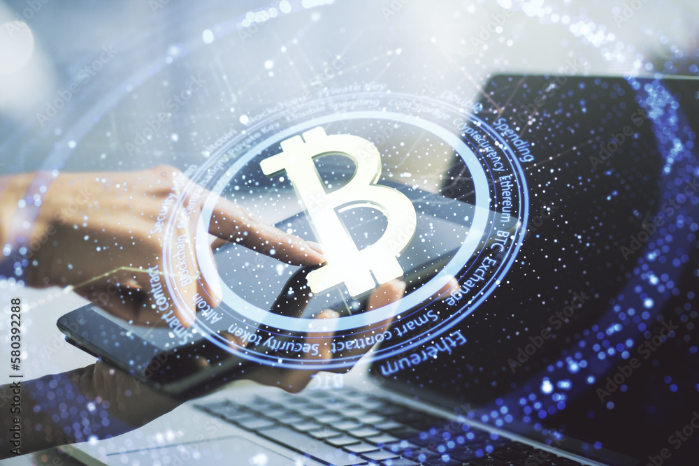 Poster double exposure of creative bitcoin symbol hologram and hand working with a digital tablet on backgr