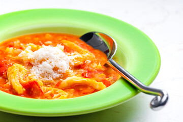 tripe and tomato soup with parmesan cheese