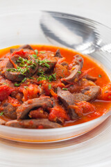 still life of kidney stew with tomatoes
