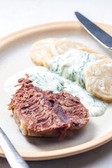 beef meat with dill sauce and dumplings