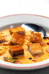 cabbage soup with smoked meat and toasted bread