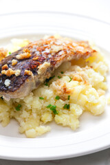 grilled carp with garlic served with mashed potatoes