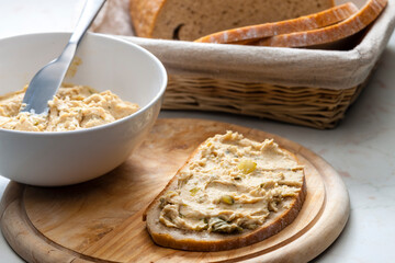 cracklings spread with pickled cucumber on slice of bread