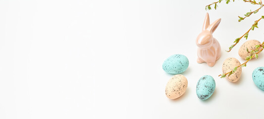 Branches with buds and green leaves, bunny, easter eggs on a white background. Happy easter concept...
