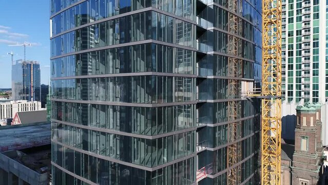 Construction of a new residential building Aerial view. Multi-storey shopping complex construction.