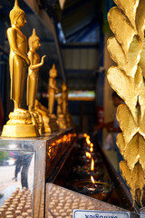 Tranquil Beauty: Candlelit Altar in a Traditional Thai Temple