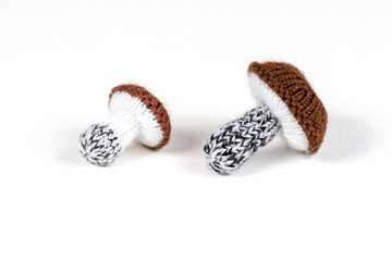 handmade knitted mushrooms isolated on white background
