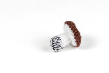 handmade knitted mushrooms isolated on white background