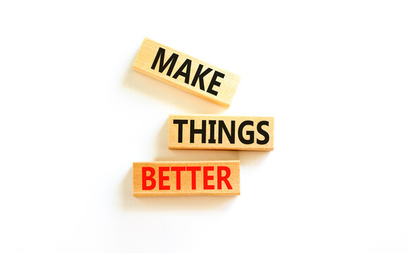 Make things better symbol. Concept words Make things better on wooden block on a beautiful white table white background. Business and make things better concept. Copy space.