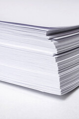 Stack of white paper for printer on gray background