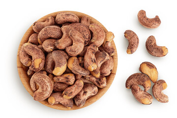 cashew nuts heap with shell in wooden bowl isolated on white background. Top view. Flat lay