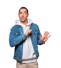 Haughty young man making a contemptuous gesture