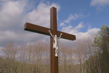 the cross with the crucifixion of Jesus on the background of the sky