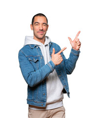 Cool young man pointing with his fingers