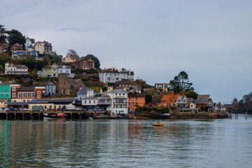 Kingswear - coastal town in Devon with vibrant and colourful buildings. View from Dartmouth side of the river 