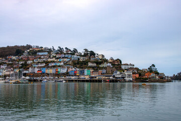 Kingswear - coastal town in Devon with vibrant and colourful buildings. View from Dartmouth side of the river 