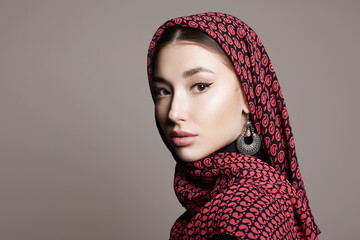 beautiful young woman in veil and jewelry