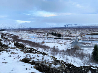 Icelandic landscape with fjord, lake and mountains in winter at Pingvellir National Park