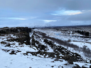 Icelandic landscape with fjord, lake and mountains in winter at Pingvellir National Park