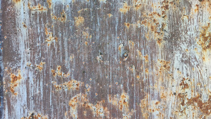 A metal plate with red rust and blue paint. Background and texture