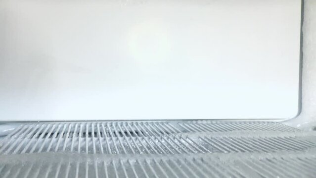 defrosting the freezer compartment from ice