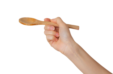 Hand holding a wooden spoon on a transparent background