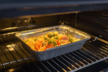 Vegetables are being roasted in the oven.