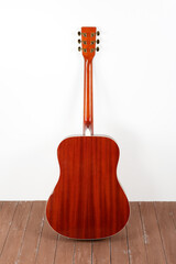 Musical instrument - back view acoustic guitar wood and white background