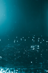 Blur abstract background with bokeh defocused lights and shadow. Blue water drops background. Trendy abstract nature background.