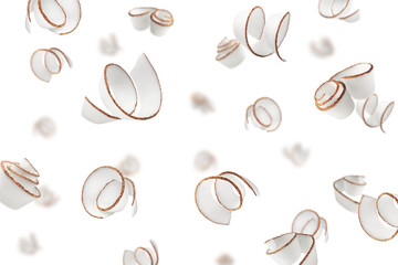 Falling Coconut curls, shavings, isolated on white background, selective focus